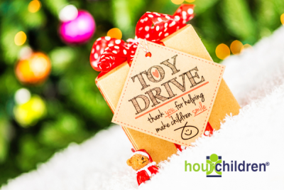 Image of a holiday gift featuring the message to participate in our Toy Drive