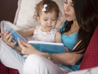 Mom reading to daughter