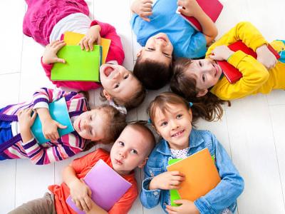 smiling kids with books