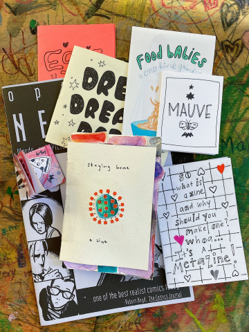 Image of a pile of zines created by Artist Rebecca Pitts