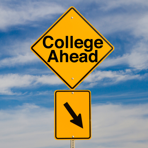 Image of a road sign that says "College Ahead"