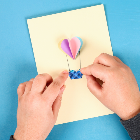 Image of a card with a heart shaped hot air balloon