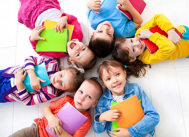 group of kids with books