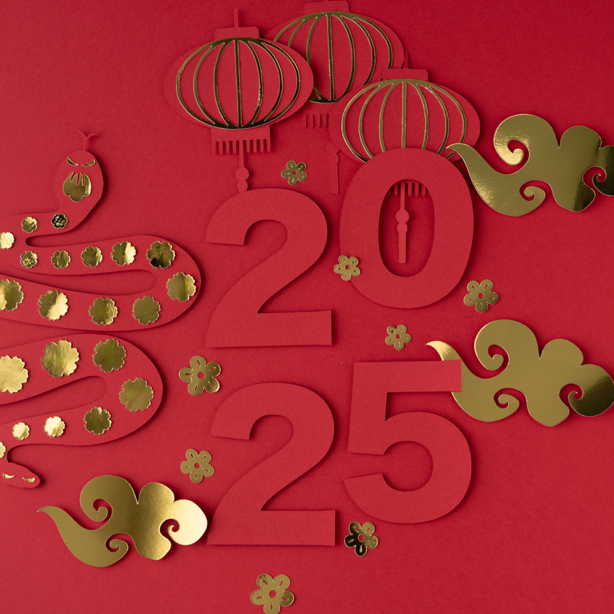 Image of a paper cut out of the year 2025 with symbols from lunar new year on a red background